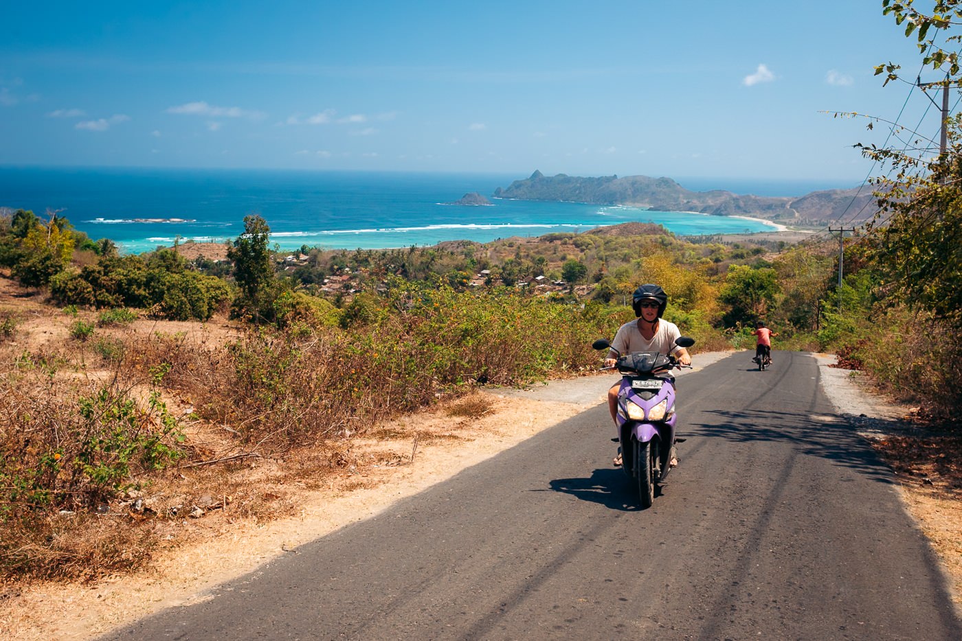 Scooter rider on a coastal road in south Lombok near Kuta