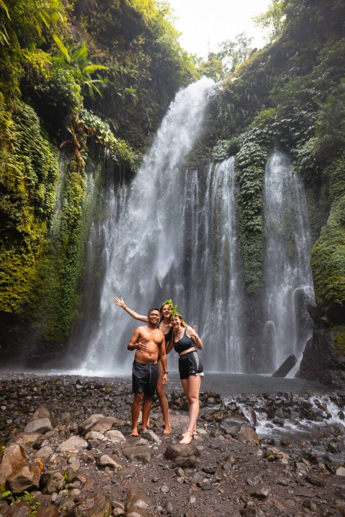 Traveler and local guide at Tiu Kelep waterfall