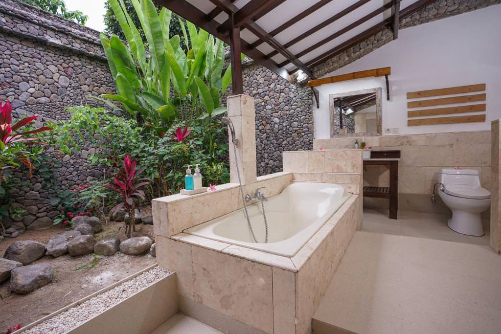 Our Honest Rinjani Lodge Review: Lombok 8 Outdoor bathroom with plants