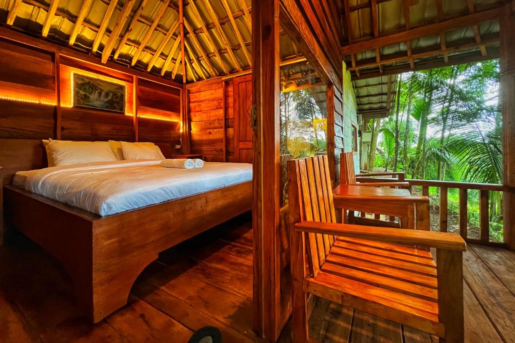 Where to Stay in Tetebatu 11 Aulia Bungalows Tetebatu bedroom with forest view